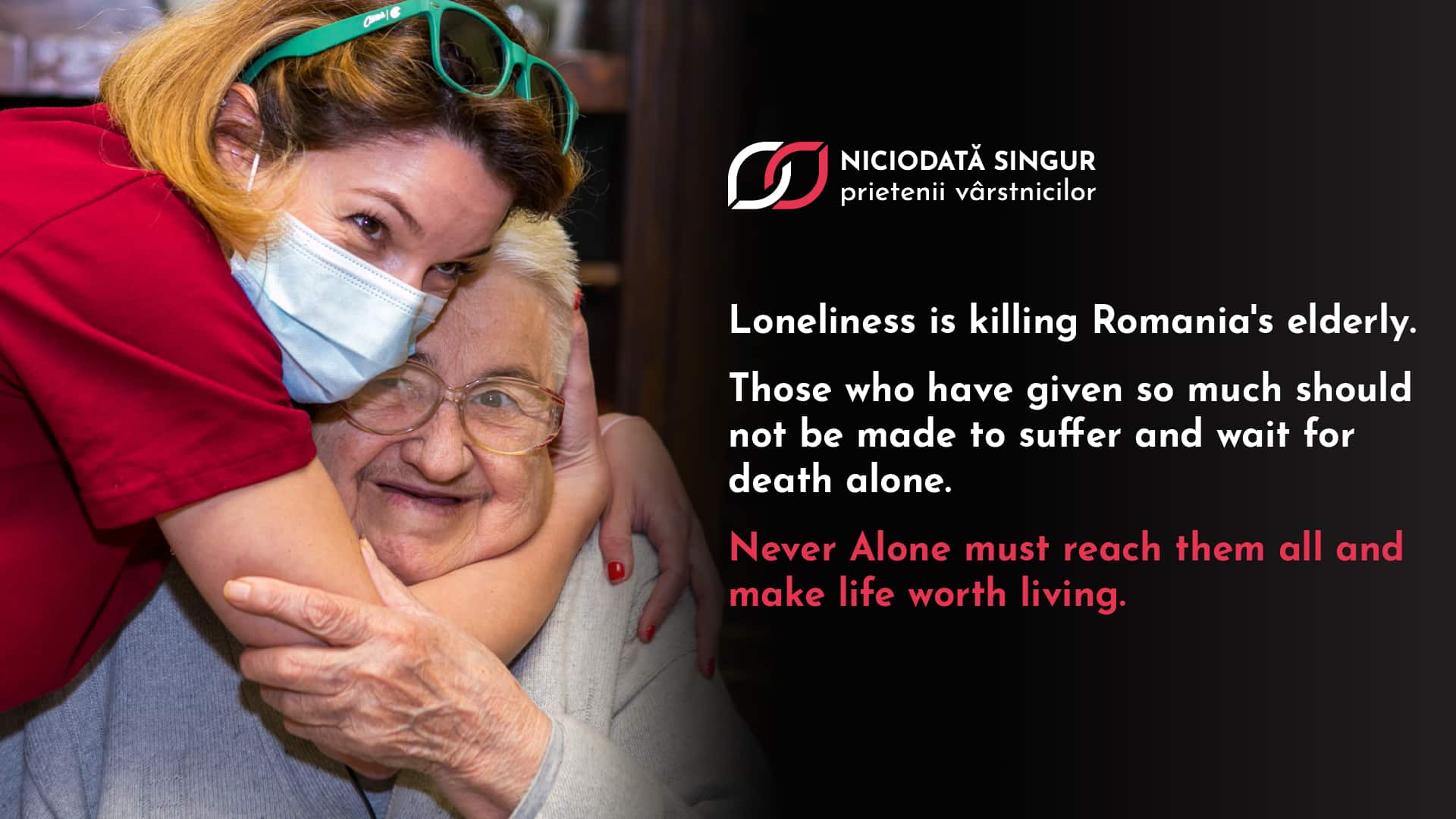 Never Alone's new ambition. Image of a young woman in a face-mask hugging a smiling older person