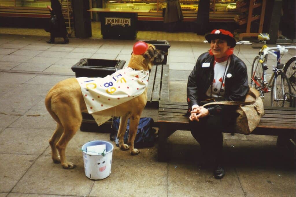 Vera Jefferson and canine friend in the Westgate Centre collecting on Comic Relief Day 1989
