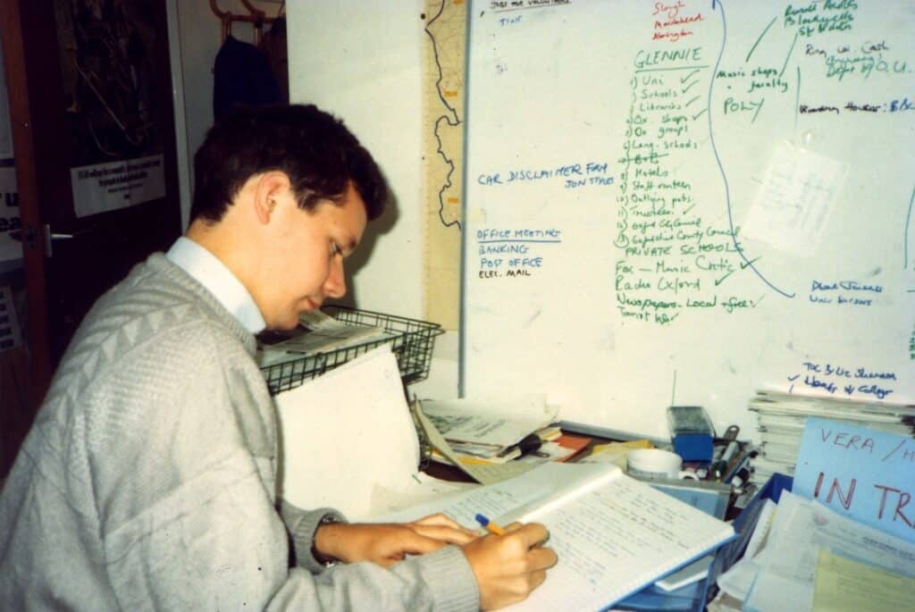 Howard Lake in the Oxfam Area Office in Headington, Oxford, beside Vera's in-tray. 1989.